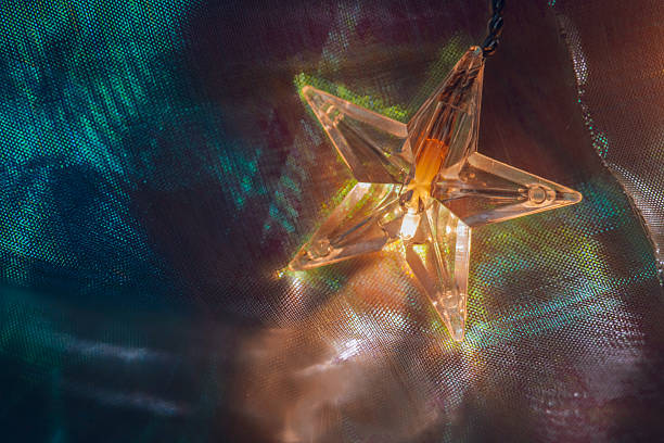 istock Glowing Star Decoration with Colorful Background 2211383815