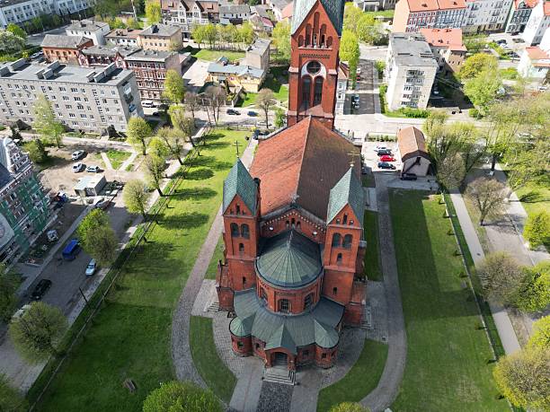 istock Church with twin towers and central dome, featuring arched windows. 2211384748