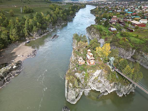 istock Aerial view of a riverside town within a verdant valley 2211384826