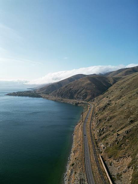 istock Scenic coastal landscape with winding road along cliff edge. 2211385007