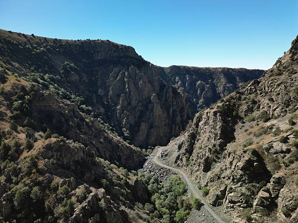 istock Rugged mountain landscape with steep cliffs and rocky terrain, sparse vegetation 2211385046