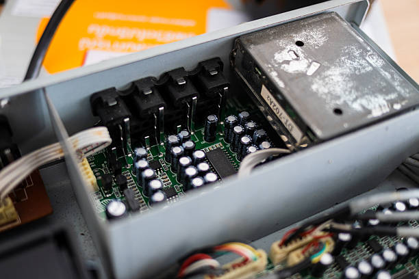 istock Examining circuit board components in a technology workshop close-up view industrial environment 2211387774