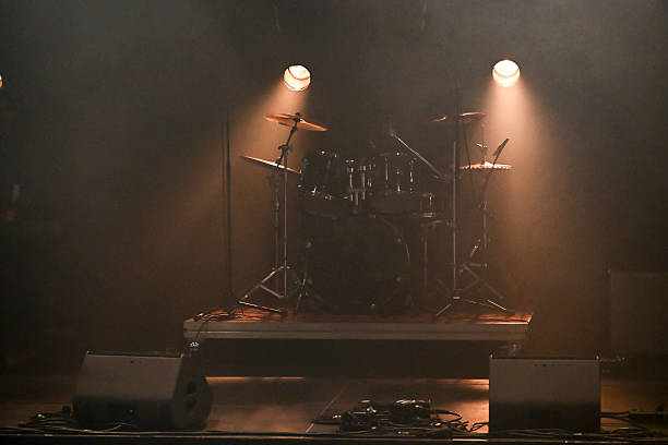 istock Exciting live concert atmosphere with dramatic lighting and eager audience anticipation 2211389524
