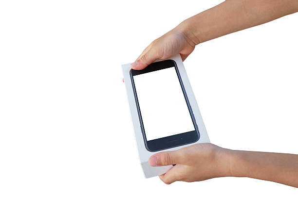 Boy's hand holding a smartphone box on a white background.