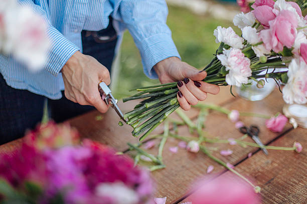 istock Florist Cutting Flowers for a Bouquet 2211391385