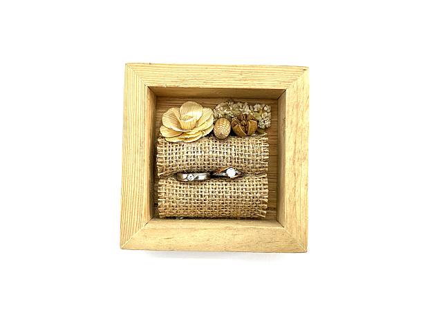 istock Rustic wooden ring box with two wedding rings 2211391483