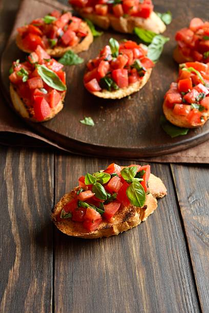 istock Bruschetta with with cherry tomatoes and basil 2211392238