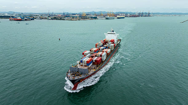 istock container ship carrying goods for international import export, business and industry regarding cargo transportation services to consumers and dealers by container ship around the world, 2211393265