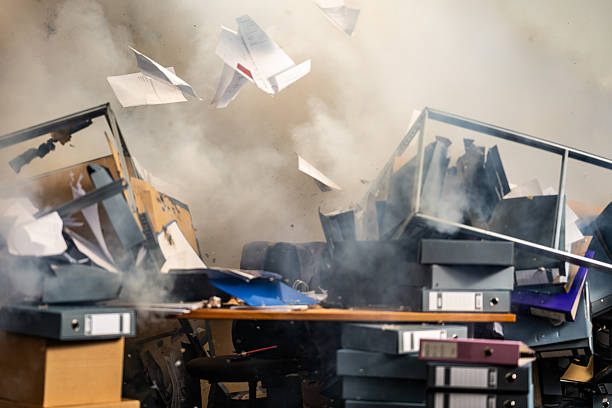 istock Office Explosion with Flying Papers and Collapsed Shelves 2211398082