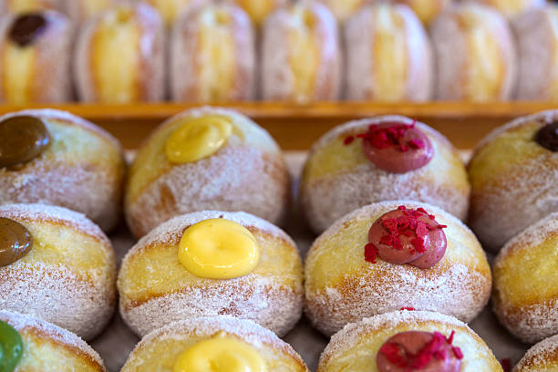 istock Colorful filled beignets in pastry tray 2211403926