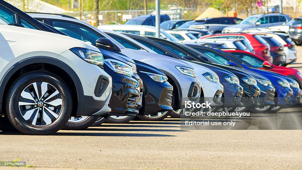 New VW cars of different models lined up close together Hamburg, Germany - April 21. 2025: New VW cars of different models lined up close together. 16: Format Car Dealership Stock Photo New VW cars of different models lined up close together Hamburg, Germany - April 21. 2025: New VW cars of different models lined up close together. 16: Format Car Dealership Stock Photo