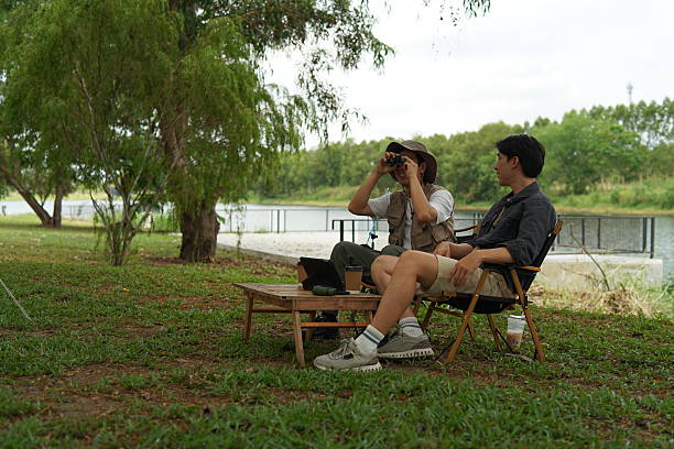 istock A man and his Friend go to camping at nature park during vacation. 2211404708
