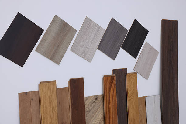 istock Many different samples of wooden flooring on light background 2211408373