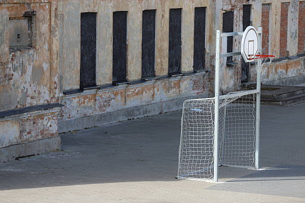 istock basketball hoop and goal in a degraded context 2211410538