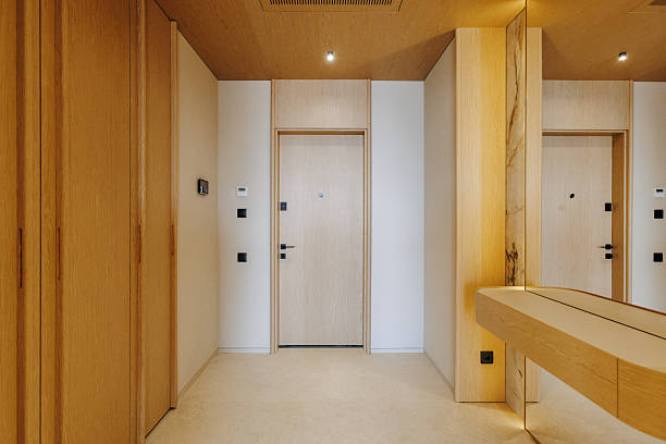 istock A long hallway featuring a door alongside a mirror mounted on the wall 2211411605