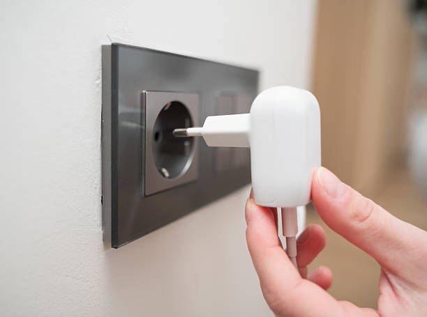 istock A charging device that has been plugged into a wall outlet is ready for use to charge its battery 2211411883