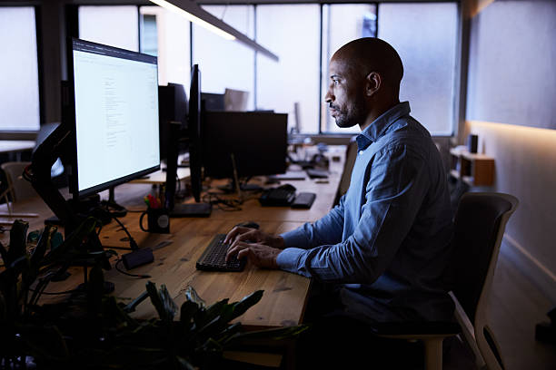 istock Focused on the computer screen as the night advances. 2211412541