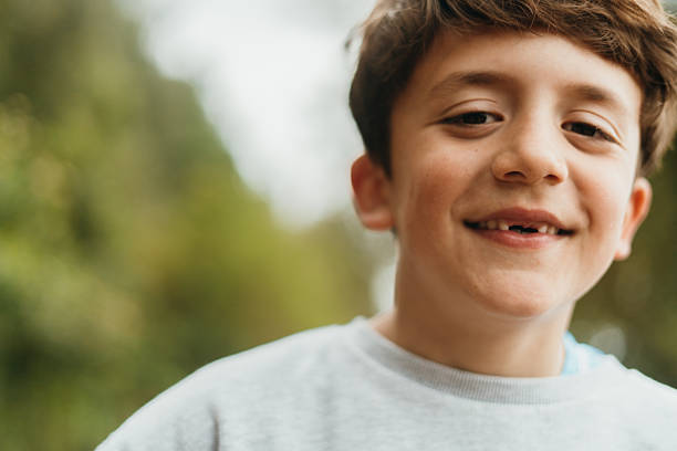 istock Portrait of boy smiling 2211412779