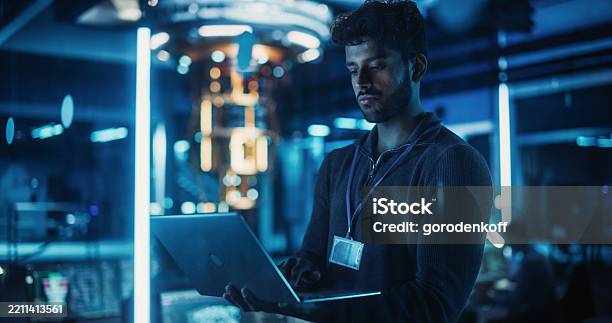 Dark Software Developer Indian Software Developer Standing In A Dark Modern Office Working On A ...