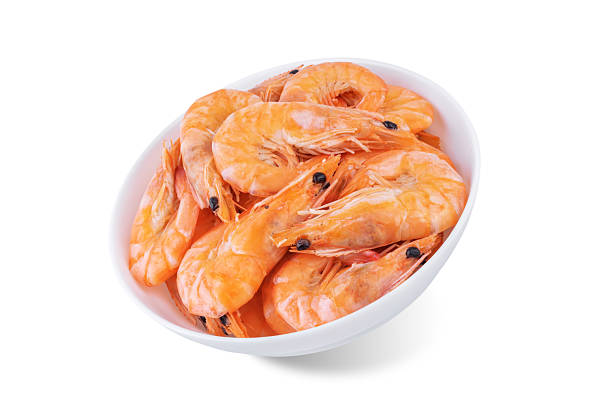 istock Cooked shrimps  in a bowl on a white isolated background 2211414543