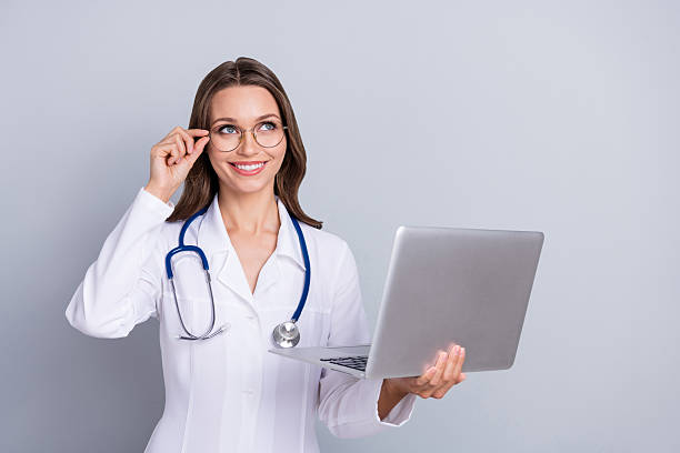 istock Photo of specialist doc lady hold netbook empty space easy online vaccine entry queue isolated over grey color background 2211416363