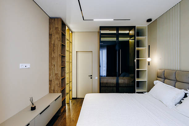 istock A cozy bedroom featuring a large bed along with a stylish wardrobe 2211417728
