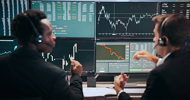 istock Computer screen, finance or men with headset for stock market, financial analytics or investment review. Fintech, business or back of people with monitor for trading, revenue charts or statistics 2211420375