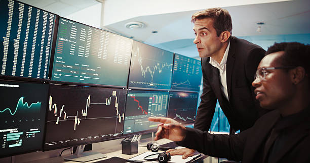istock Computer screen, invest and business people in office, conversation and internet with connection. Employees, traders and advice for stock market, pc and financial growth with website info with stats 2211420421