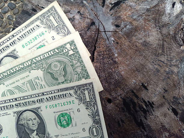 istock Three US 1 dollar banknotes. One dollar. US banknotes. Top view. Business concept. 2211421315