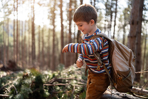 Boy hiking in the woods.