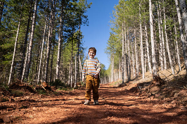 Boy hiking in the woods.
