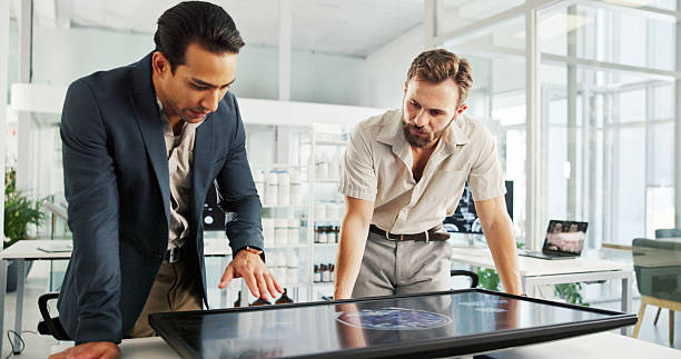 istock Men, discussion or screen with brain x ray for medical examination or neurology study at office. Health professionals, neurologist or surgeons with interactive display, MRI or CT scan on test results 2211424743