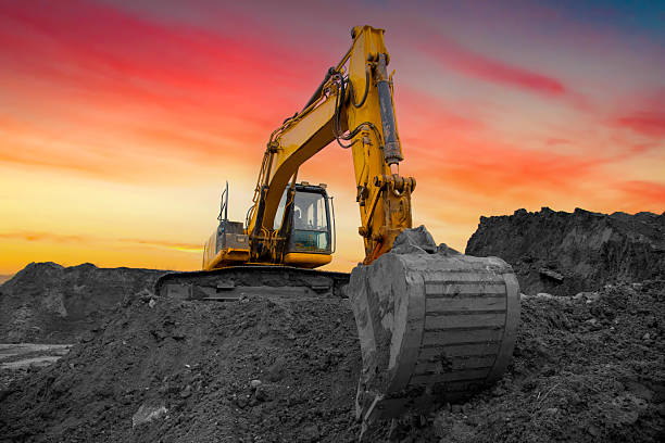 istock Coal mining in an open-pit. Excavator on Coal mining. Excavator digging in open pit coal mine. 2211425383