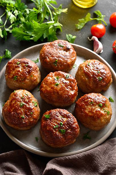istock Roasted cutlets from beef and pork meat 2211435529