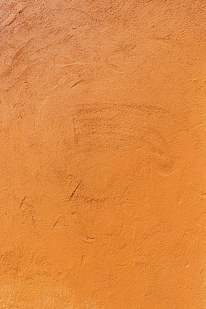 istock Texture of an old orange plastered wall. 2211436685