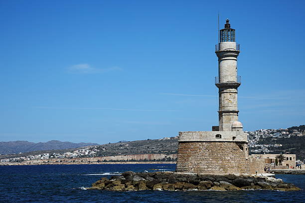 Manavgat harbour entrance and lighthouse with man fishing, bad weather