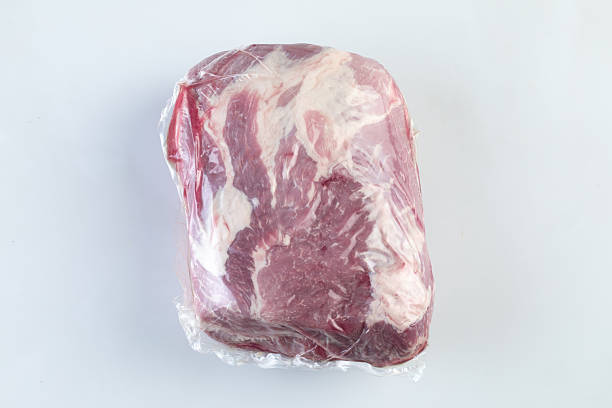 istock Red meat wrapped in plastic isolated nature background with clipping path 2211438274