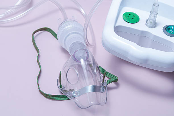 istock A clear plastic mask with a green strap is attached to a tube 2211438723