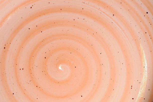 istock Orange pink spiral design ceramic detail close up 2211439644