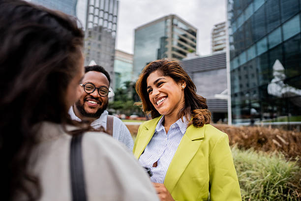 istock Coworkers talking in the street 2211440850