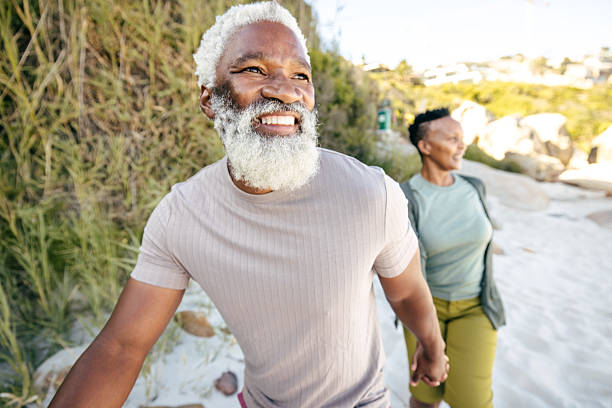 istock Strolling Through Life: A Family Walk by the Shore 2211441604