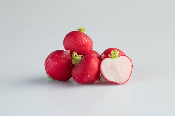 istock red radish isolated nature background with clipping path 2211443354