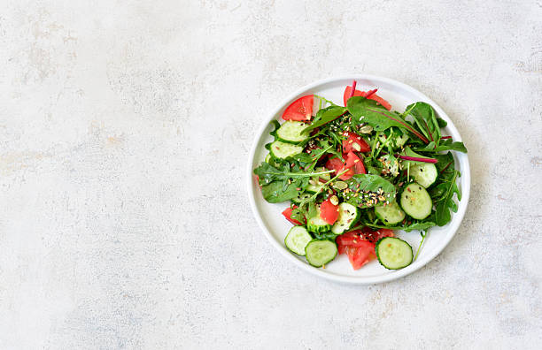 istock a plate of healthy salad with vegetables and greenery copy space 2211444323