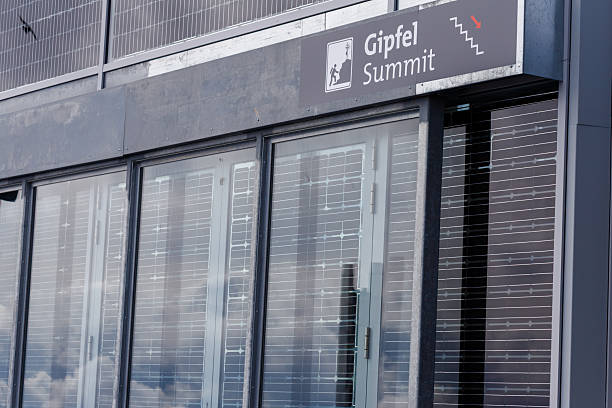 istock Building Exterior with Solar Panel Windows and Summit Signage 2211447319