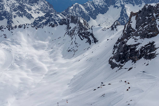 A beautiful view from the Zugspitze summit on the Alps on at spring. Bavarian Alps, Germany. Zugspitze Ski Resort. Spring in the Bavarian Alps.
