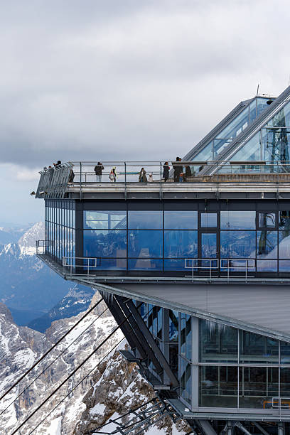 istock Mountain Peak Building with Viewing Platform and People 2211447454
