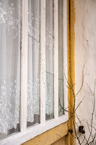 istock Old Window and Bare Branch in the Village 2211447727