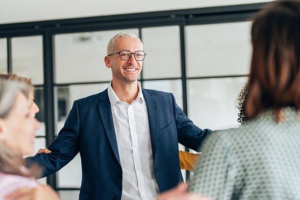 istock Cheerful team huddle in the office 2211448393