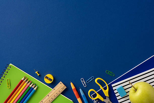 istock School supplies arranged on a blue background featuring colorful pencils, notebooks, and accessories, evoking organization and learning 2211449228