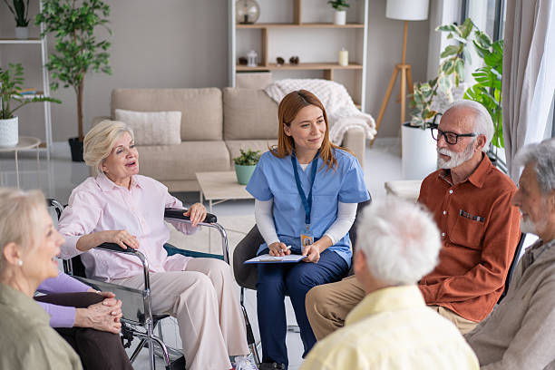 istock Therapist Guiding Seniors in Supportive Environment 2211451229